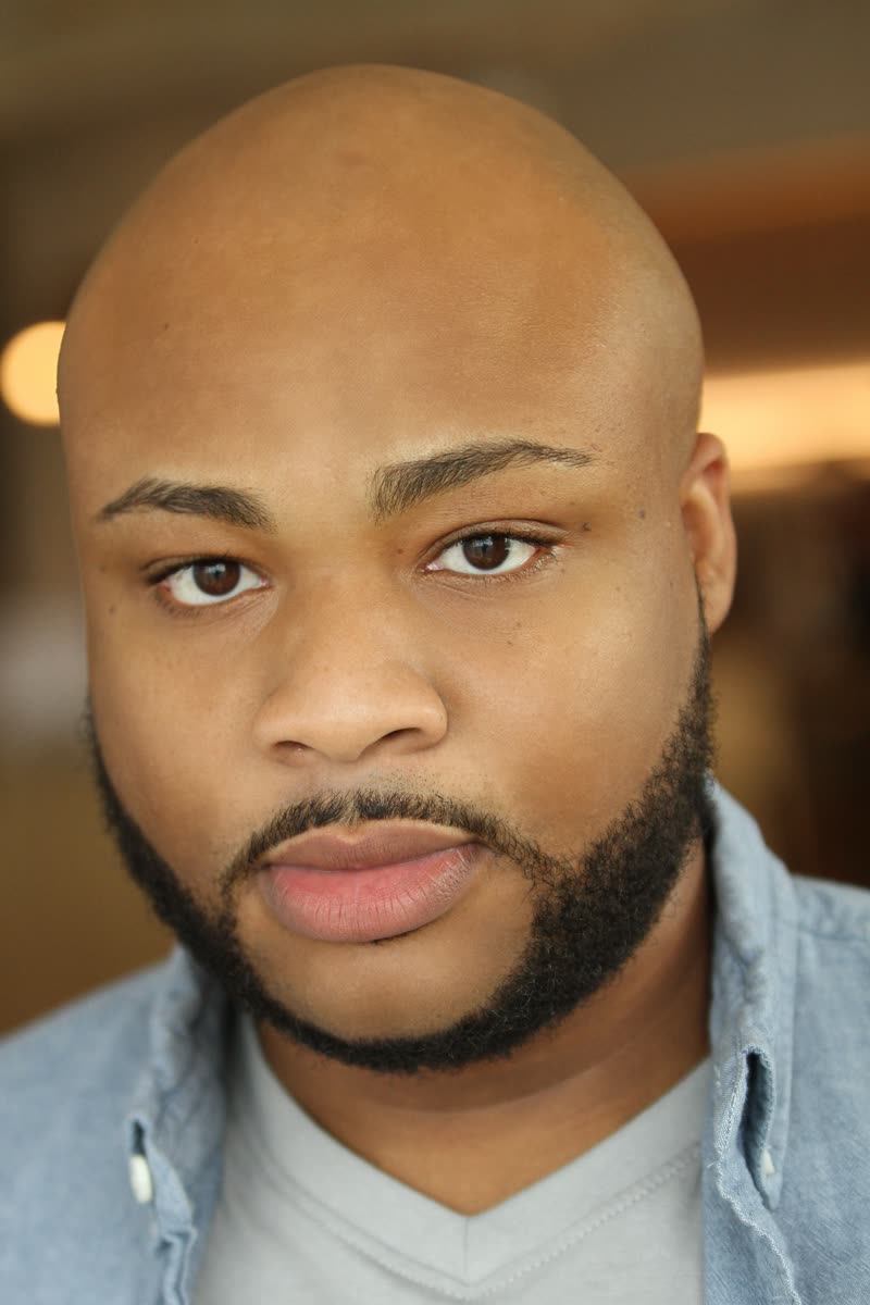 Close-up headshot of Scottie Stowe in a denim shirt